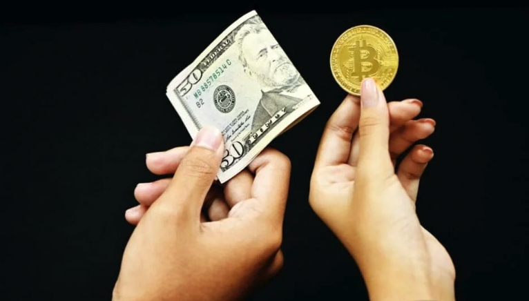 Exchanging U.S. dollars for Bitcoin.